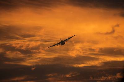 A C-130 Hercules flies over Yokota Air Base, Japan, during a routine sortie Sept. 12, 2017.